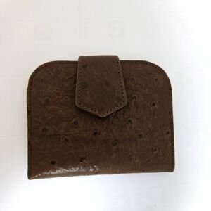 Brown leather change purse.